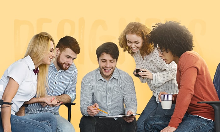 Graphic designers and UX writers cooperating in design studio