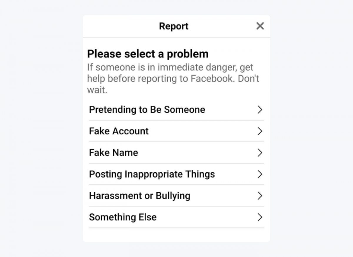 Report a profile menu option on Facebook